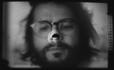 photograph of Jon Beaton as seen through a camera viewfinder